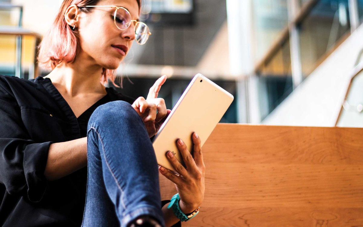 Young Woman Using Tablet.