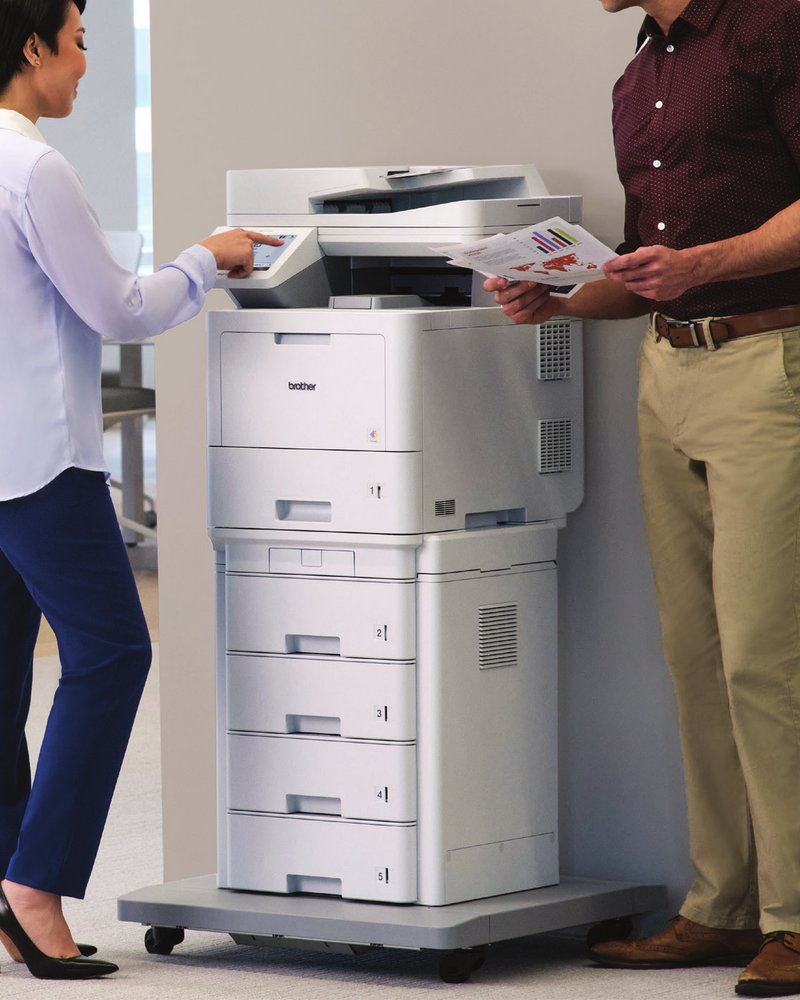 Brother MFC-EX670w enterprise color laser all-in-one printer with optional tower tray, shown in an office.